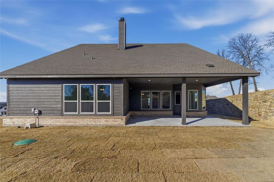 Exterior details and patio area of a home in Oak Grove Addition, Springtown (Image 4).