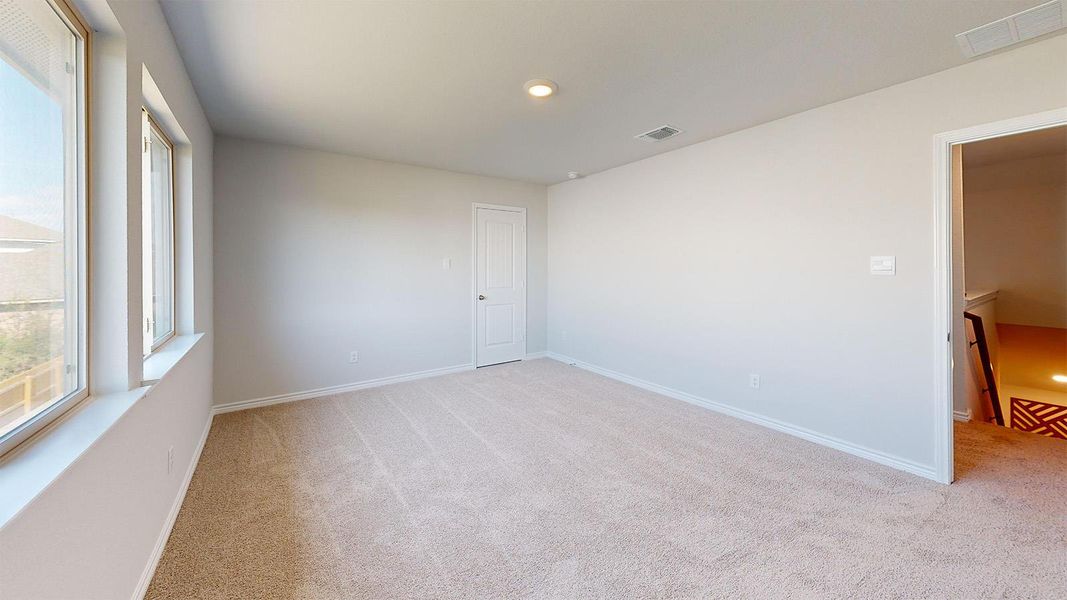 Spare room with light carpet and recessed lighting Spare room with light carpet and recessed lighting