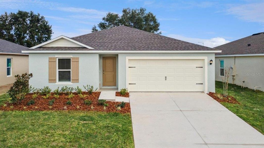 Front exterior of a new home in , Haines City, FL, highlighting curb appeal (Image 1). Front exterior of a new home in , Haines City, FL, highlighting curb appeal (Image 1).