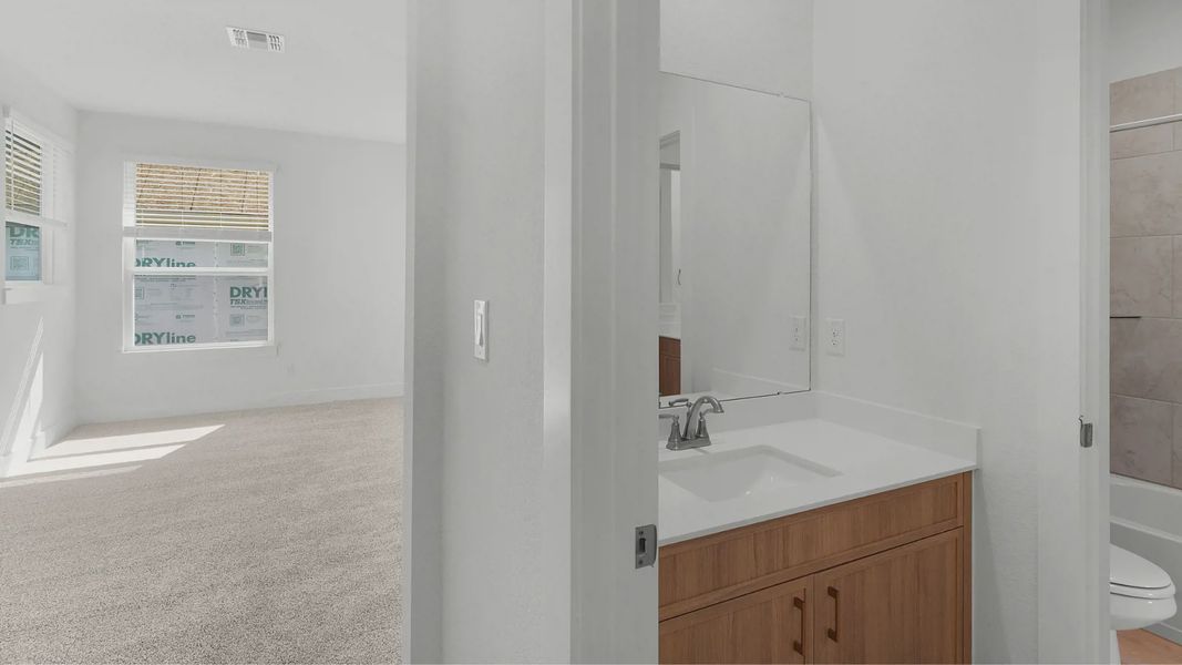 Representative furnished interior of a home built from the Archer by Chesmar Homes in Santa Rita Ranch, Liberty Hill (Image 12).