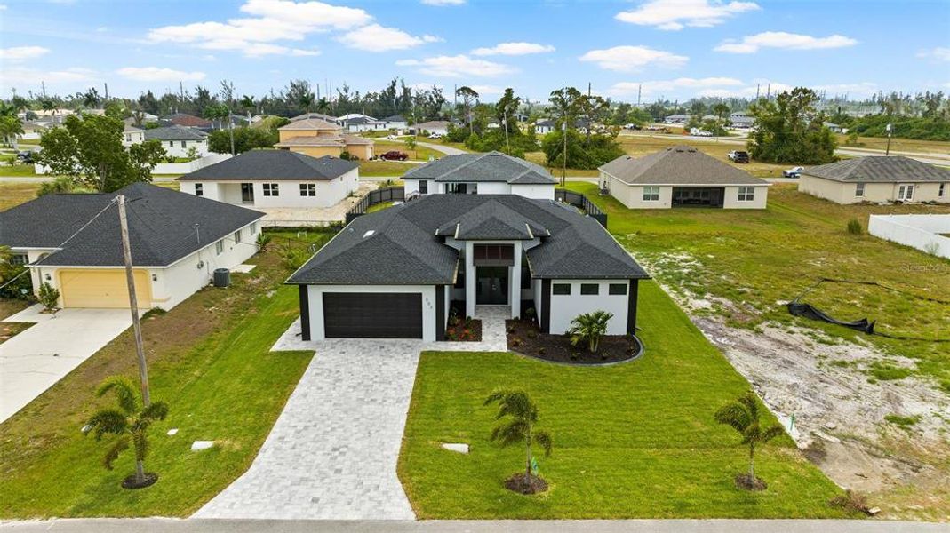 Front exterior of a new home in , Cape Coral, FL, highlighting curb appeal (Image 24).
