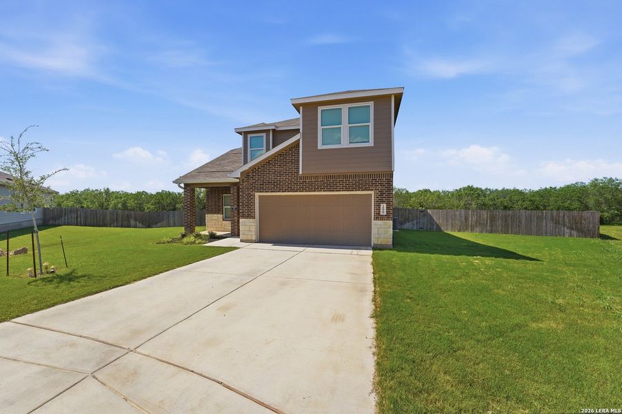 Front exterior of a new home in Guadalupe Heights, Seguin, TX, highlighting curb appeal (Image 21).