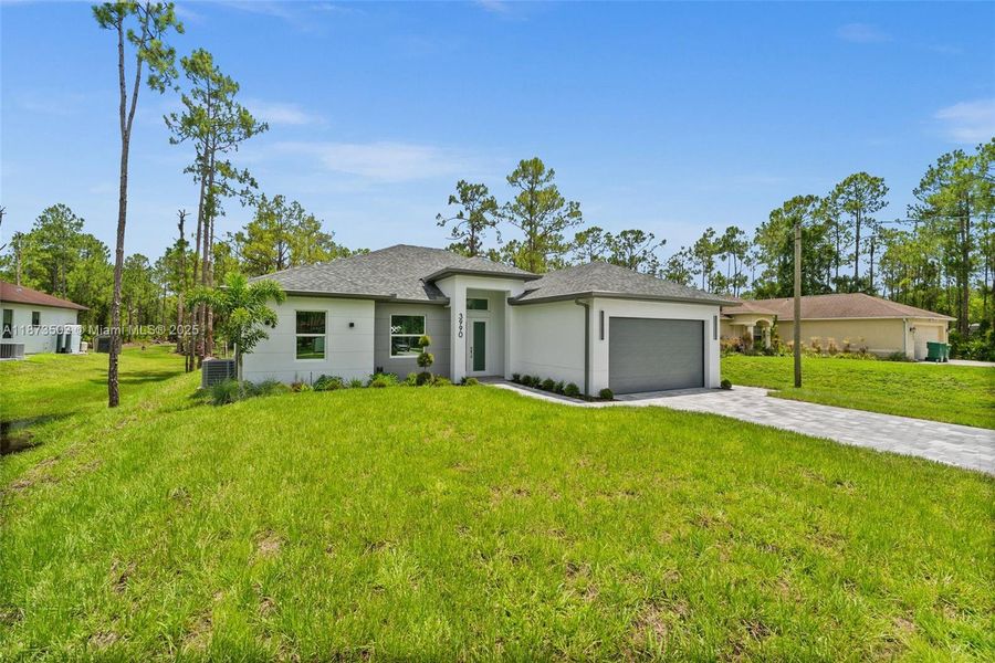 Front exterior of a new home in , Naples, FL, highlighting curb appeal (Image 2).