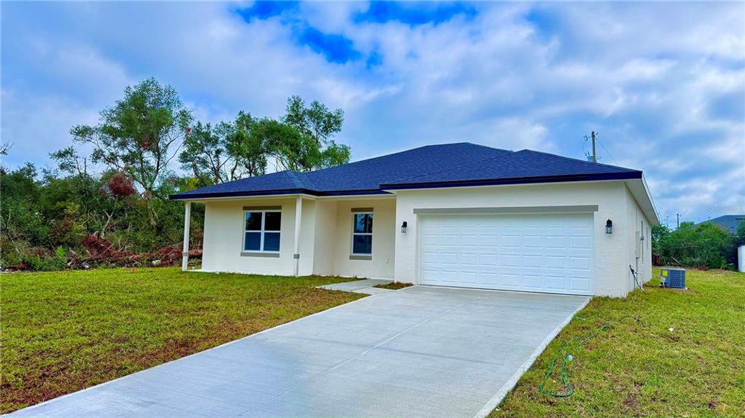 Front exterior of a new home in , Ocala, FL, highlighting curb appeal (Image 20). Front exterior of a new home in , Ocala, FL, highlighting curb appeal (Image 20).