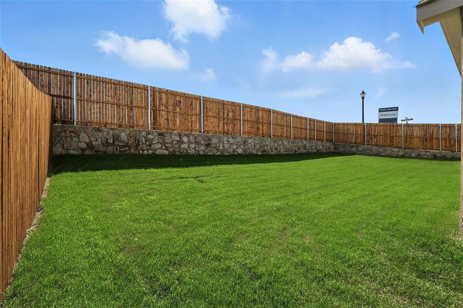 View of fenced backyard