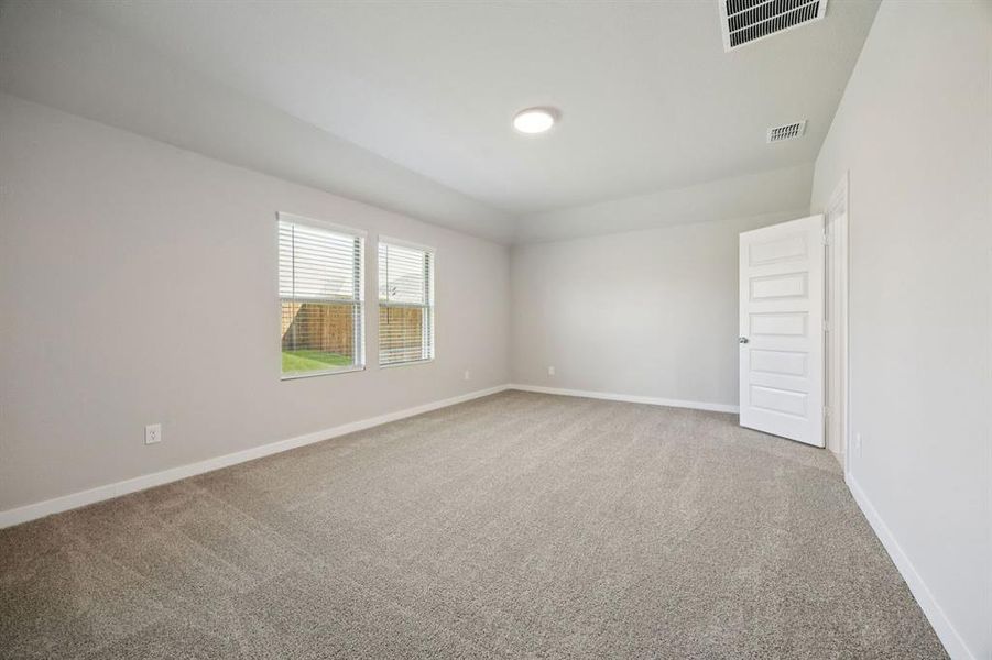 Primary Suite in the Oscar home plan by Trophy Signature Homes – REPRESENTATIVE PHOTO