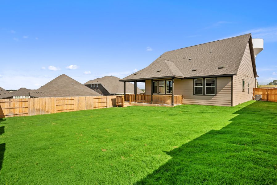 Representative exterior photo of a completed home built from the Texoma by Ashton Woods in The Colony 50s, Bastrop, TX (Image 19).