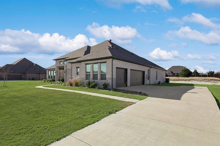 Front exterior of a new home in Oak Creek Ranch, Midlothian, TX, highlighting curb appeal (Image 23).
