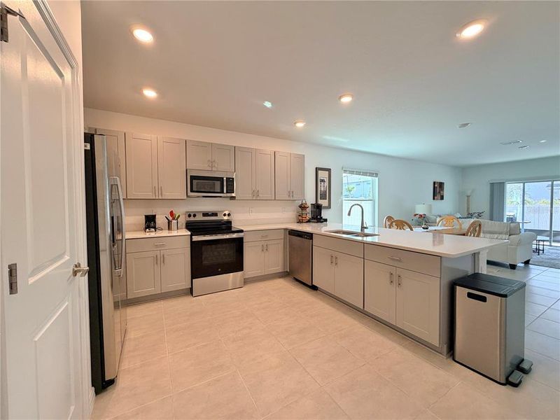 Furnished interior view inside a new home in Westview Community Group Page, Kissimmee (Image 9).
