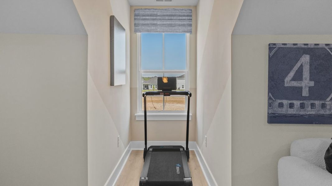 Bonus room nook in the Summit home plan featuring natural light and flexible living space. Bonus room nook in the Summit home plan featuring natural light and flexible living space.