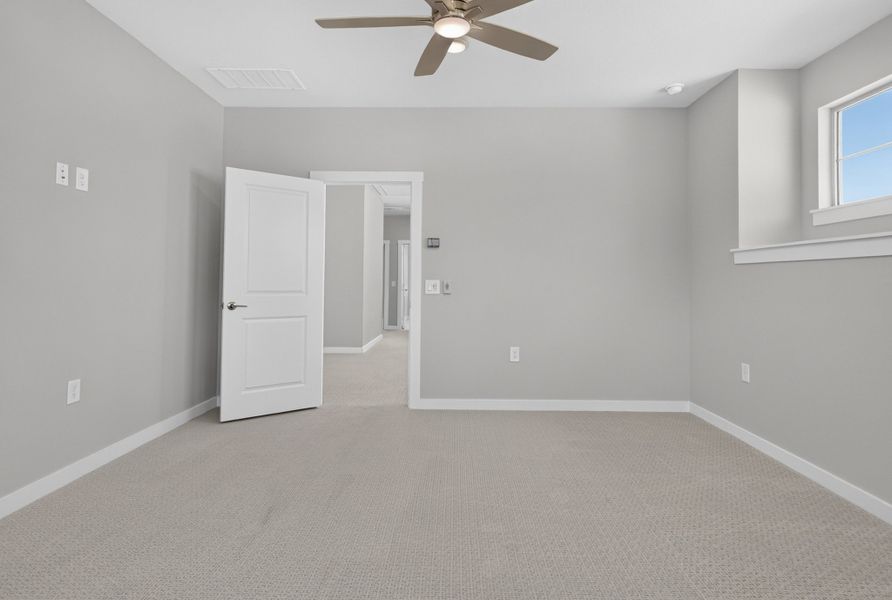 Spacious, unfurnished interior of a new home in The Tribute, The Colony (Image 38).