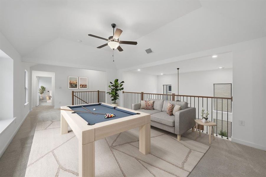 Game room with pool table, light colored carpet, ceiling fan, and vaulted ceiling