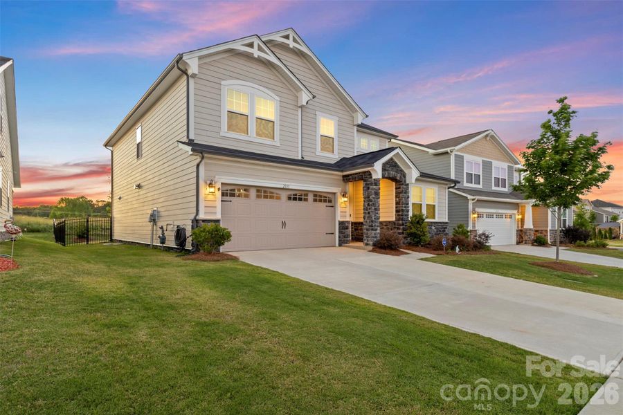 Front exterior of a new home in Waxhaw Landing, Monroe, NC, highlighting curb appeal (Image 22).