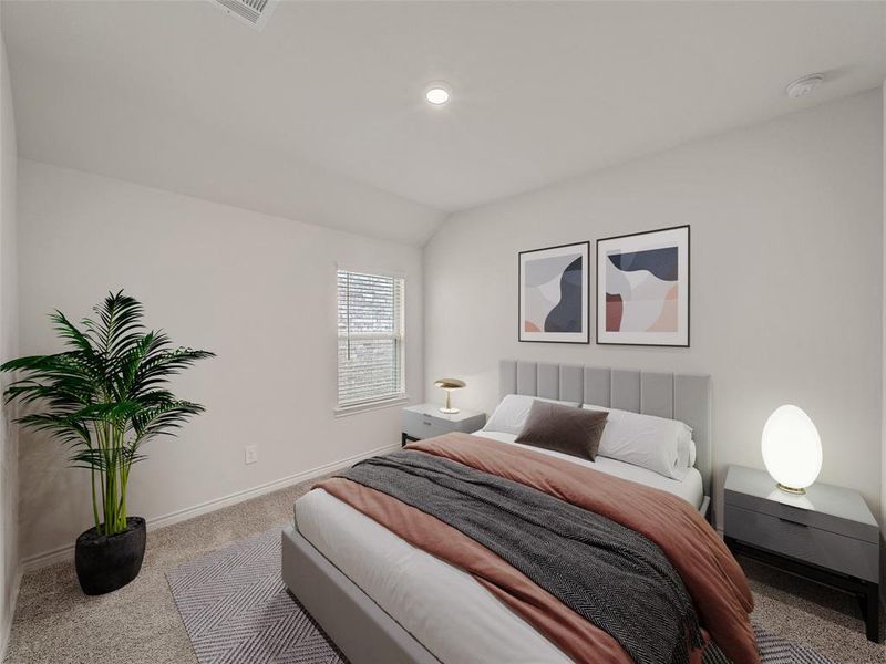 Bedroom with baseboards, visible vents, lofted ceiling, and carpet
