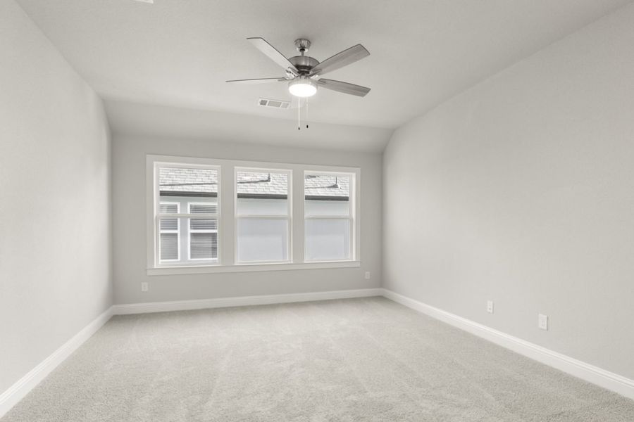 Image of a flex space with light grey carpeting and painted walls with three large windows