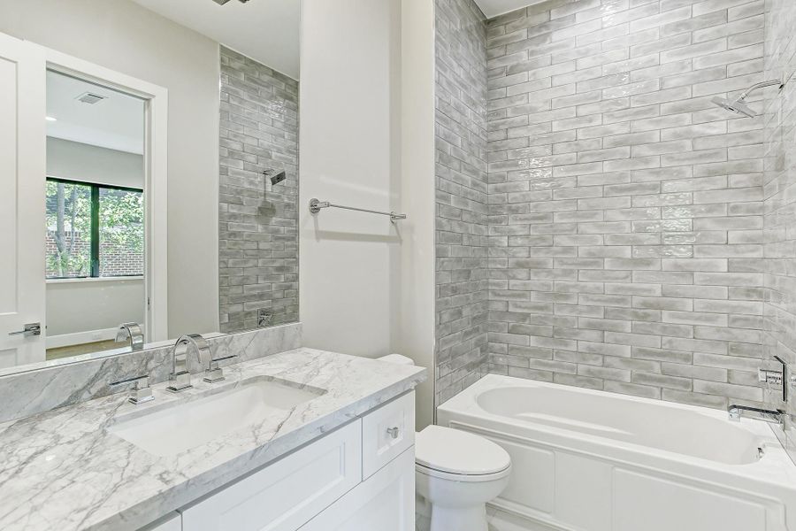 Each full bathroom with either walk-in shower or tub. Please note lovely tile work which goes to the ceiling. Each full bathroom with either walk-in shower or tub. Please note lovely tile work which goes to the ceiling.