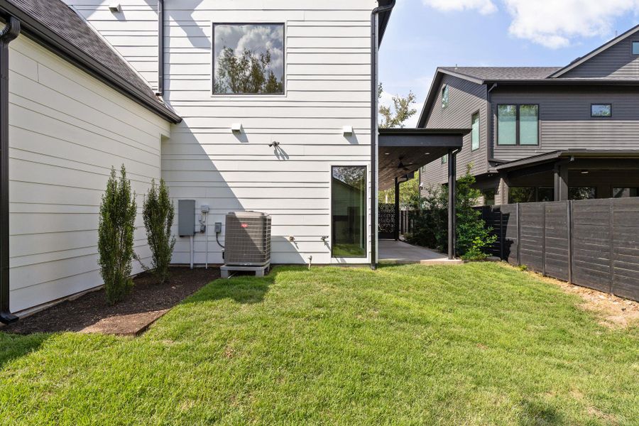 Rear view of property featuring a patio and a ceiling fan