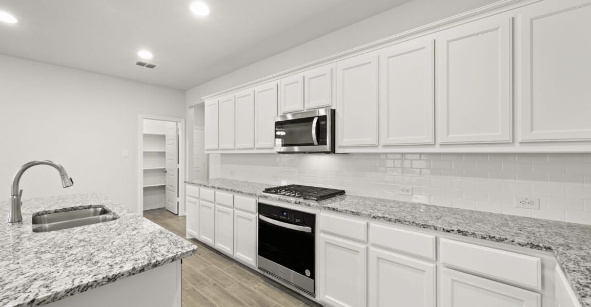 Representative exterior photo of a completed home built from the Oliver by Impression Homes in Redden Farms, Midlothian, TX (Image 9). Representative exterior photo of a completed home built from the Oliver by Impression Homes in Redden Farms, Midlothian, TX (Image 9).