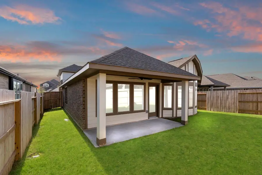 Exterior details and patio area of a home in Grand Central Park, Conroe (Image 4).