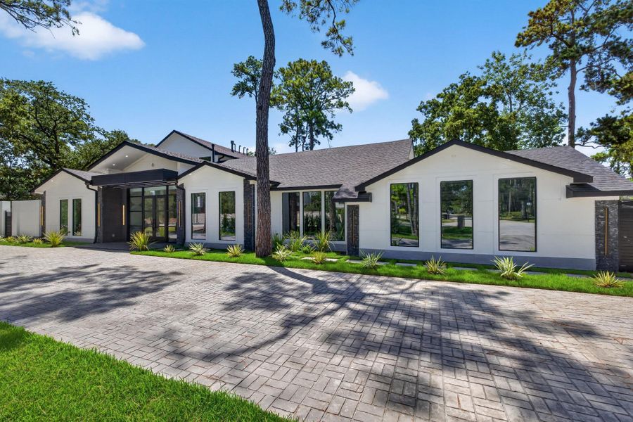 Circular drive and broad front elevation provide an impressive sense of arrival.