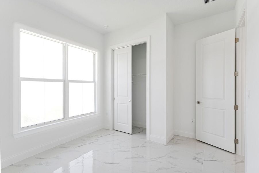 Furnished interior view inside a new home in Salerno Reserve - Single Family, Stuart (Image 28). Furnished interior view inside a new home in Salerno Reserve - Single Family, Stuart (Image 28).