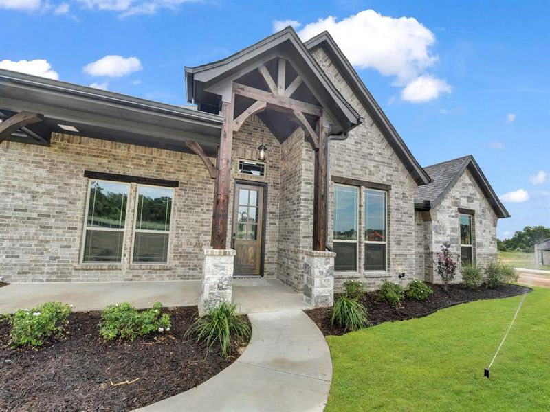 Front exterior of a new home in , Azle, TX, highlighting curb appeal (Image 21). Front exterior of a new home in , Azle, TX, highlighting curb appeal (Image 21).