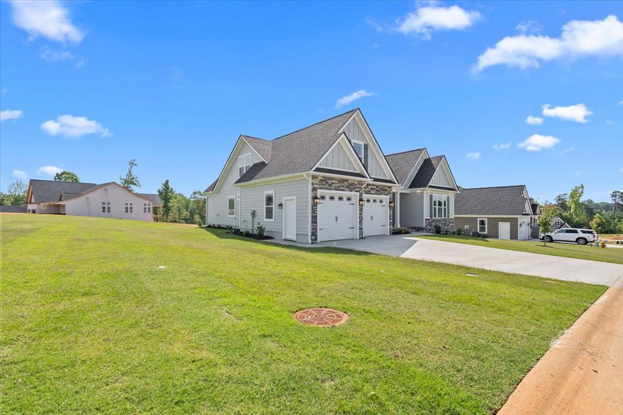 Representative exterior photo of a completed home built from the Hartford Elite by Enchanted Homes in Smokey Hills, Campobello, SC (Image 23).