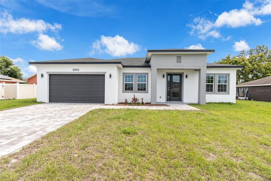 Front exterior of a new home in , Ocala, FL, highlighting curb appeal (Image 20).