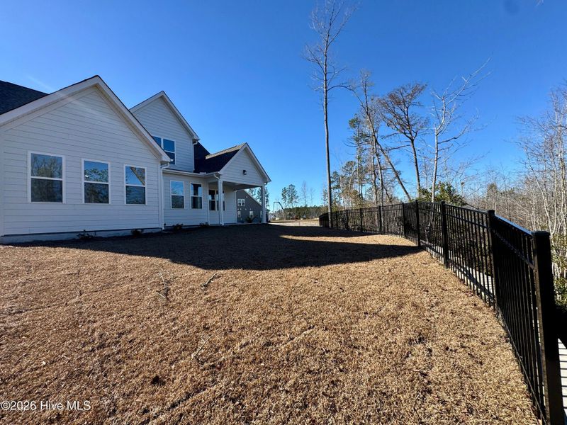 Exterior details and patio area of a home in Terrapin, Leland (Image 32).