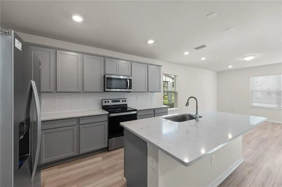 Furnished interior view inside a new home in EverBe, Orlando (Image 5).