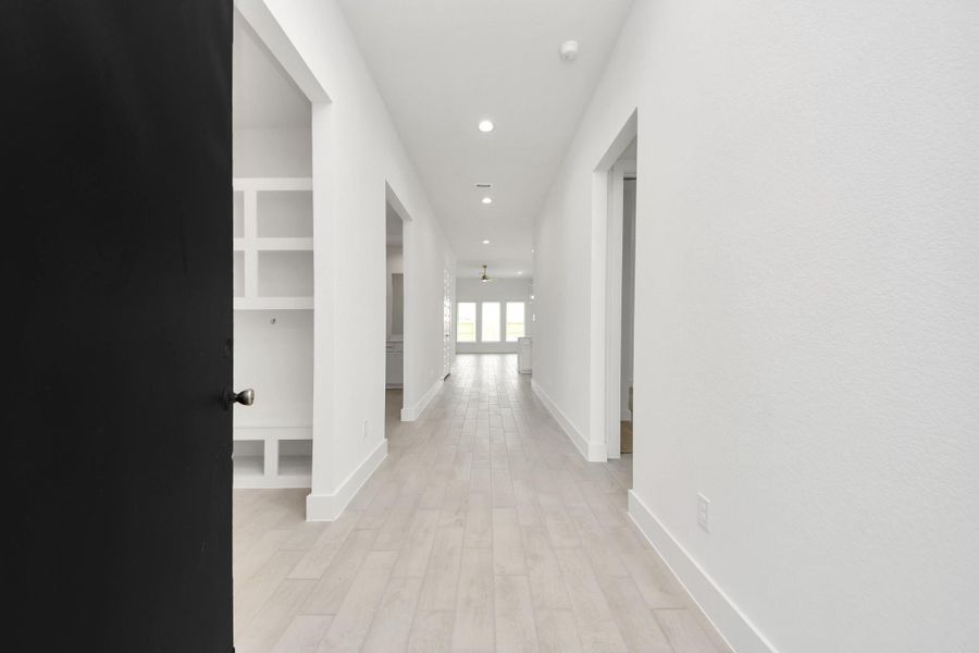 As you step into the threshold of this luxurious home, you'll soon be welcomed by an elegant glass door (to be installed). Inside, soaring ceilings amplify the spaciousness, while the refined wood-look tile flooring and oversized baseboards exude sophistication and charm. As you step into the threshold of this luxurious home, you'll soon be welcomed by an elegant glass door (to be installed). Inside, soaring ceilings amplify the spaciousness, while the refined wood-look tile flooring and oversized baseboards exude sophistication and charm.
