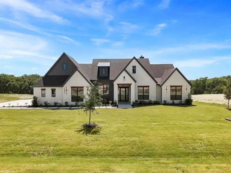 Front exterior of a new home in , Midlothian, TX, highlighting curb appeal (Image 2). Front exterior of a new home in , Midlothian, TX, highlighting curb appeal (Image 2).
