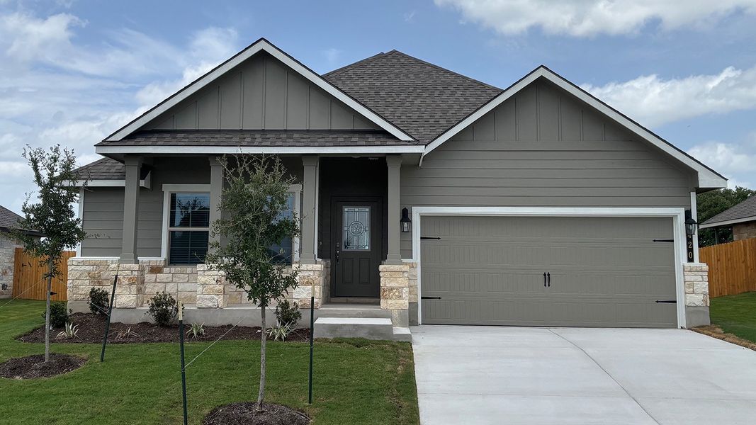 Front exterior of a new home in Creekfall, Burnet, TX, highlighting curb appeal (Image 1). Front exterior of a new home in Creekfall, Burnet, TX, highlighting curb appeal (Image 1).