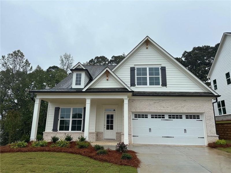Front exterior of a new home in Hemingway, Flowery Branch, GA, highlighting curb appeal (Image 1). Front exterior of a new home in Hemingway, Flowery Branch, GA, highlighting curb appeal (Image 1).