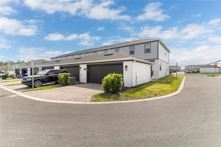 Front exterior of a new home in , Winter Garden, FL, highlighting curb appeal (Image 25).