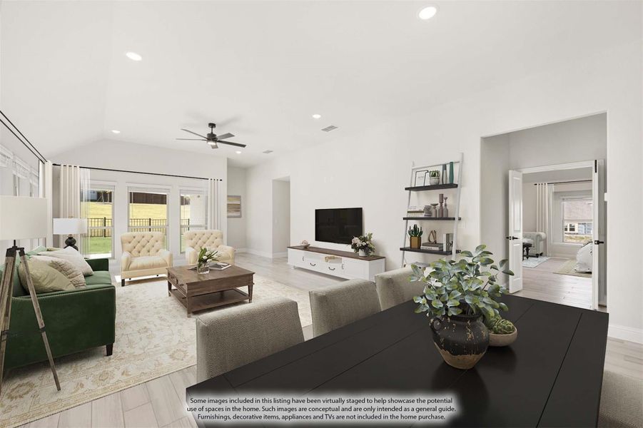 Open-concept living and dining area with vaulted ceiling, ceiling fan, light wood floors, and patio doors Open-concept living and dining area with vaulted ceiling, ceiling fan, light wood floors, and patio doors