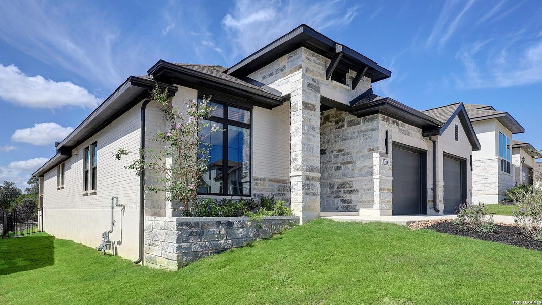 Front exterior of a new home in Esperanza, Boerne, TX, highlighting curb appeal (Image 24).