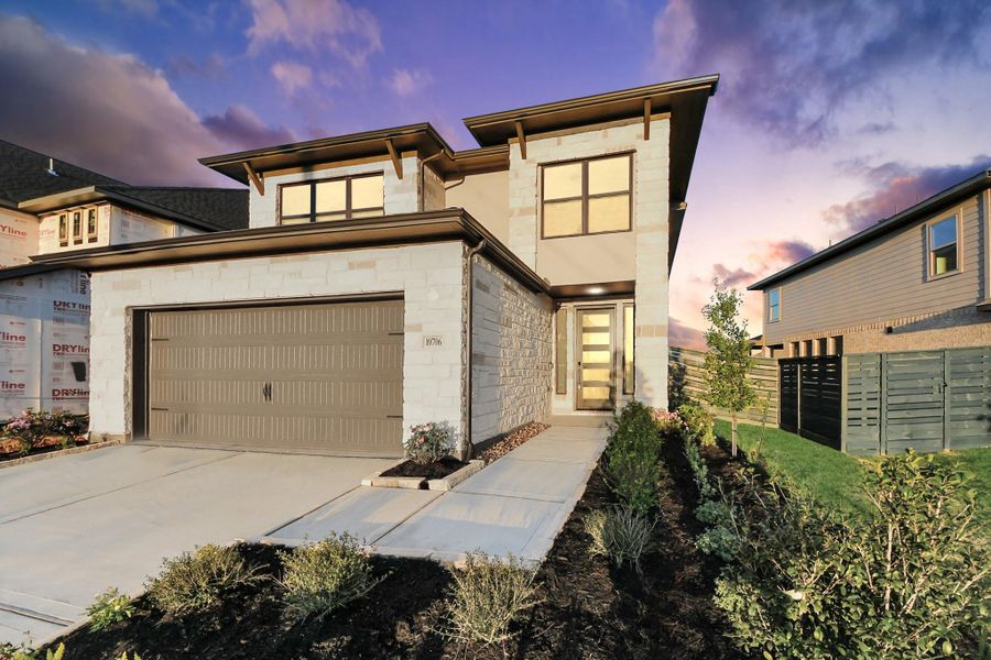 Front exterior of a new home in Austin Point, Richmond, TX, highlighting curb appeal (Image 23). Front exterior of a new home in Austin Point, Richmond, TX, highlighting curb appeal (Image 23).