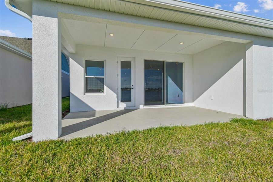 Exterior details and patio area of a home in The Peninsula at Rhodine Lake, Riverview (Image 26).