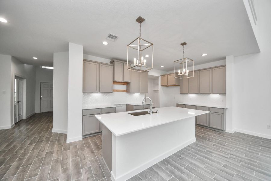 This kitchen is truly a chef's dream! This haven Boasts high ceilings, recessed & pendant lighting, stained wood cabinets, granite countertops, stainless steel appliances, a modern tile backsplash. All of this overlooks your expansive family room, creating a perfect space for culinary delights and family gatherings. This kitchen is truly a chef's dream! This haven Boasts high ceilings, recessed & pendant lighting, stained wood cabinets, granite countertops, stainless steel appliances, a modern tile backsplash. All of this overlooks your expansive family room, creating a perfect space for culinary delights and family gatherings.