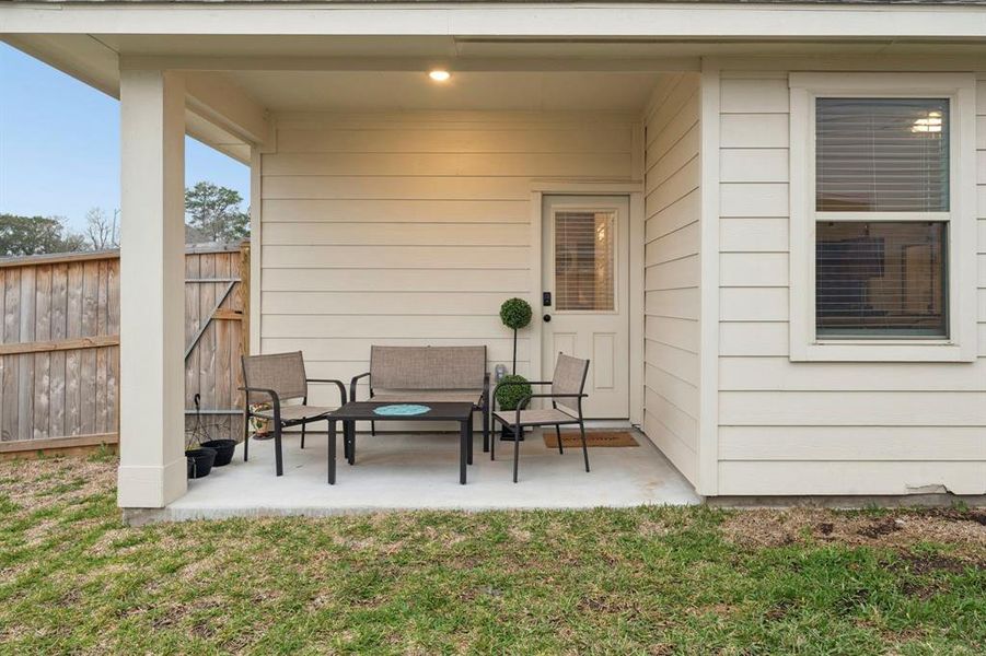 Step outside to the covered back patio, an ideal spot for morning coffee or evening get-togethers. This outdoor space is perfect for dining alfresco, gardening, or simply enjoying the fresh air.