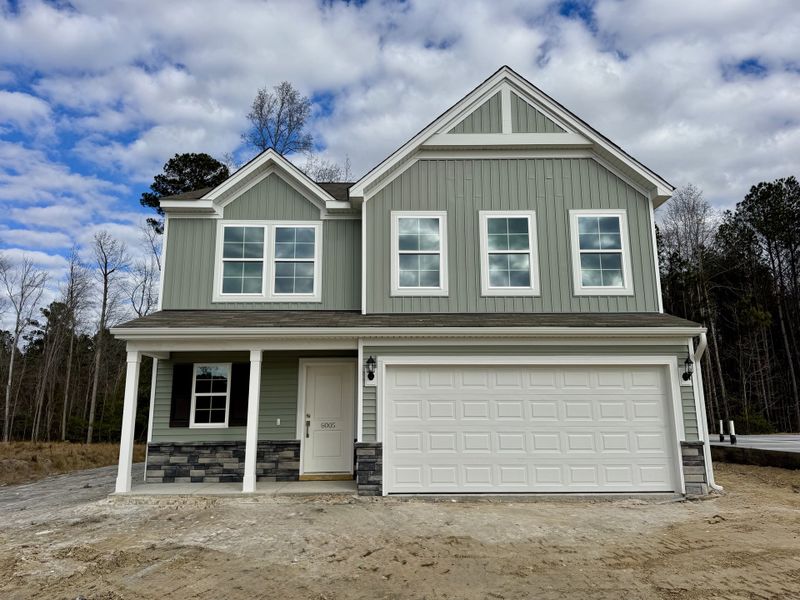 Front exterior of a new home in Ellington, Elgin, SC, highlighting curb appeal (Image 1). Front exterior of a new home in Ellington, Elgin, SC, highlighting curb appeal (Image 1).