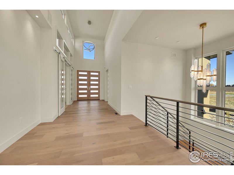 Dramatic foyer with upper windows