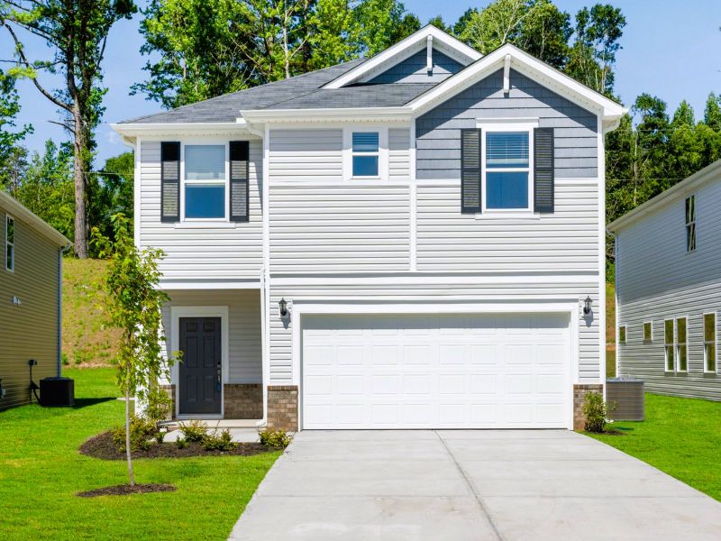 Front exterior of a new home in Creek Ridge - Heritage Collection, Spartanburg, SC, highlighting curb appeal (Image 1).