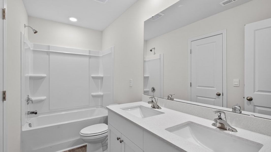 Representative furnished interior of a home built from the KYLE by D.R. Horton in Olive Branch, Clayton (Image 7).