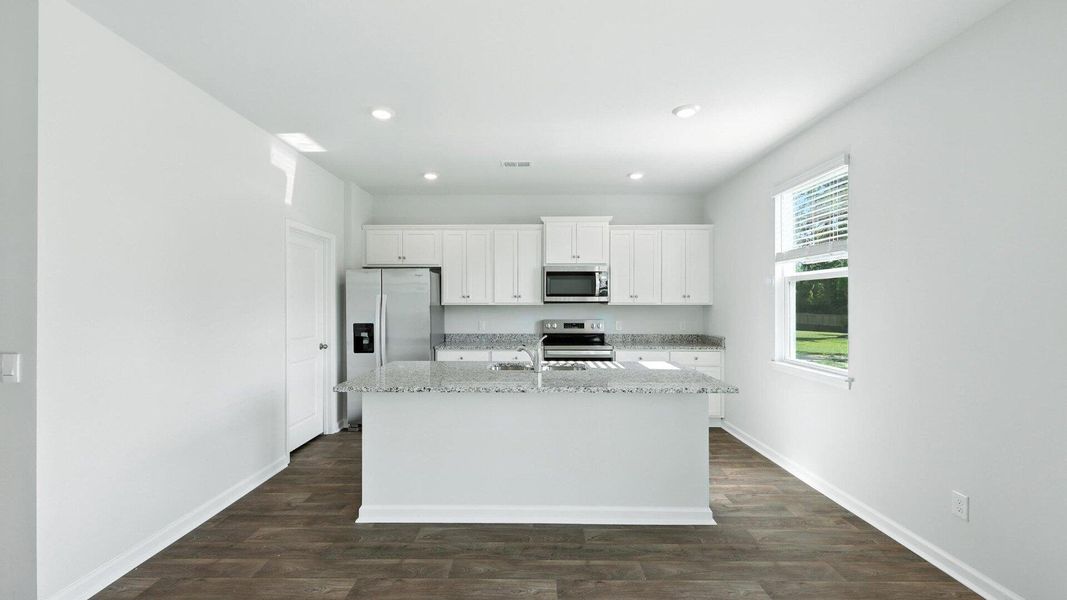 Furnished interior view inside a new home in The Ranch, Holly Hill (Image 6).