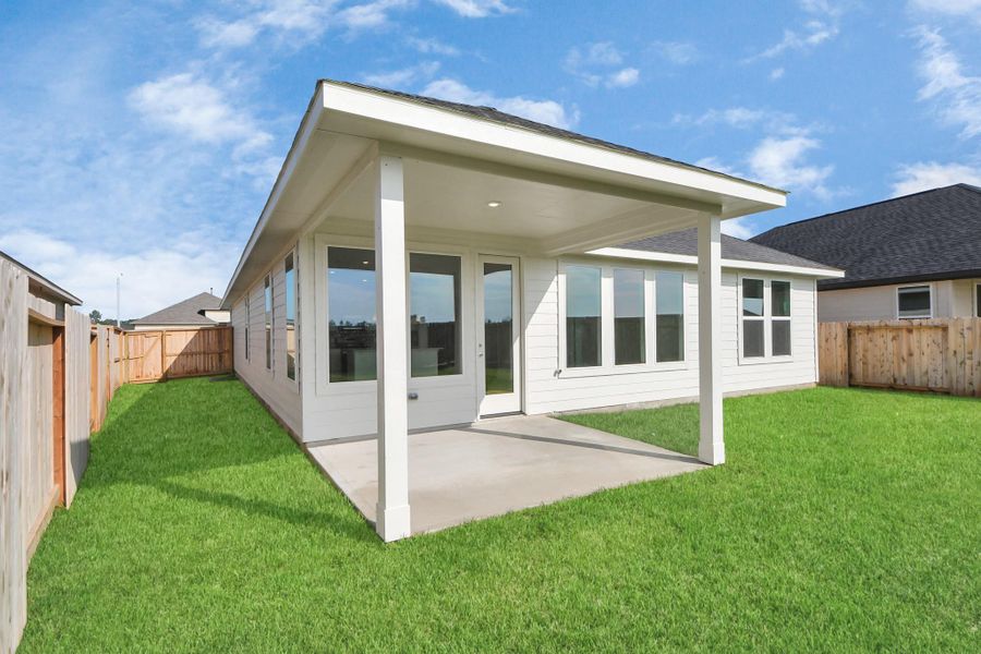 Front exterior of a new home in The Canopies, Splendora, TX, highlighting curb appeal (Image 16).