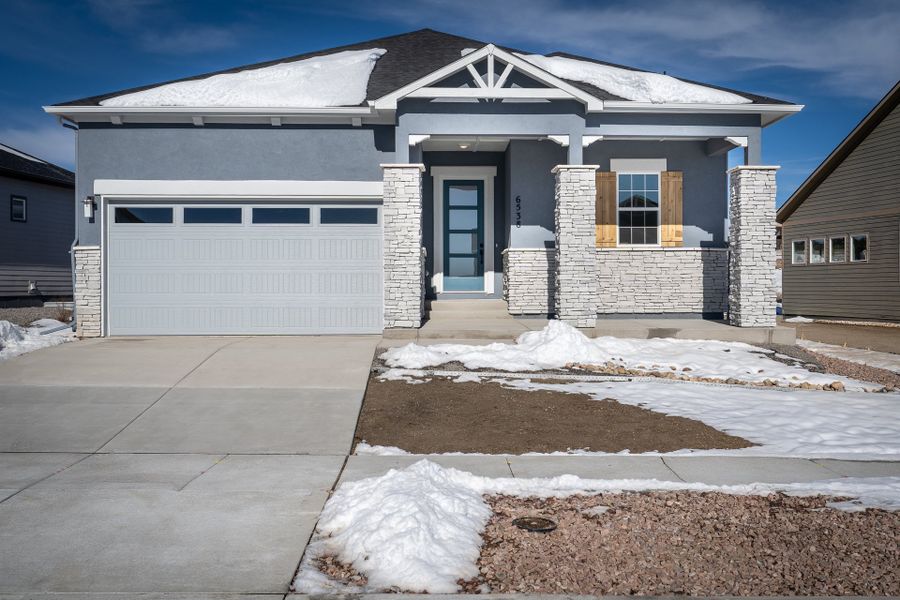 Front exterior of a new home in Wolf Ranch - Enclave Collection, Colorado Springs, CO, highlighting curb appeal (Image 1). Front exterior of a new home in Wolf Ranch - Enclave Collection, Colorado Springs, CO, highlighting curb appeal (Image 1).