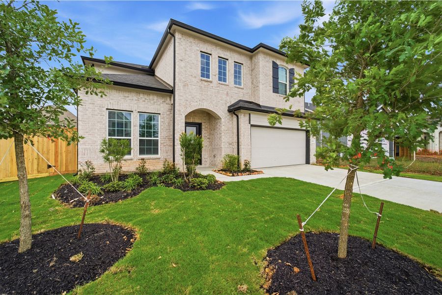 Front exterior of a new home in Ashland, Richwood, TX, highlighting curb appeal (Image 2).