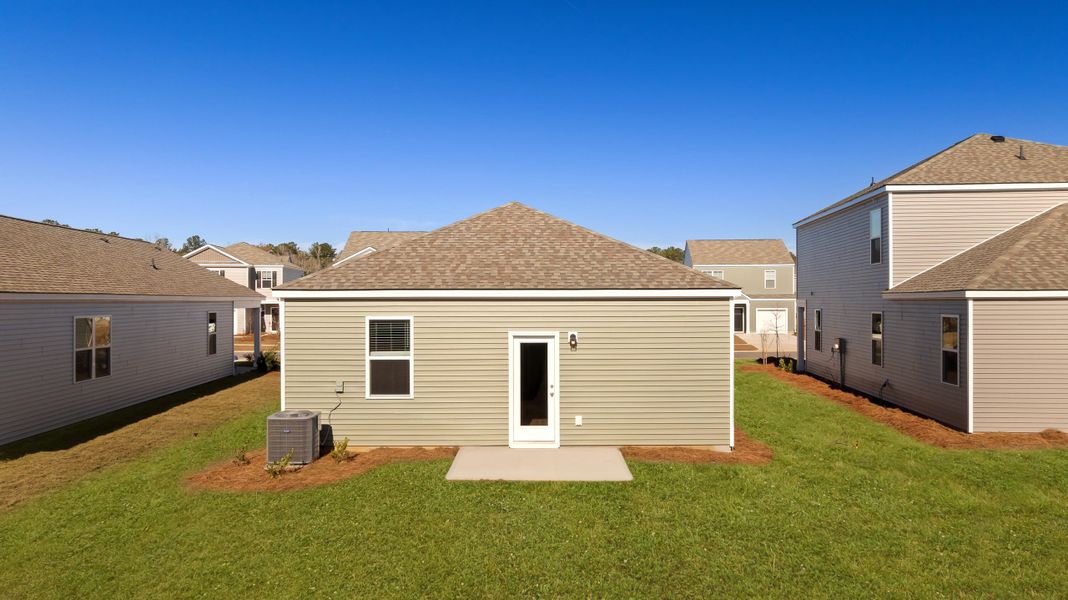 Exterior details and patio area of a home in Pine Hills at Cane Bay, Summerville (Image 2). Exterior details and patio area of a home in Pine Hills at Cane Bay, Summerville (Image 2).